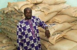 Ogobara Kodjo, the fertiliser business agent in Sélingué, with sacks of phosphate fertiliser (picture: Mike Goldwater/GWI)