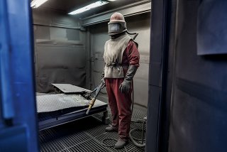 Picture of a man dismantling a nuclear center in Germany